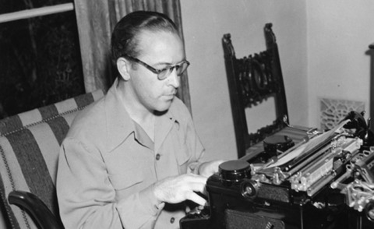 A writer at a vintage typewriter