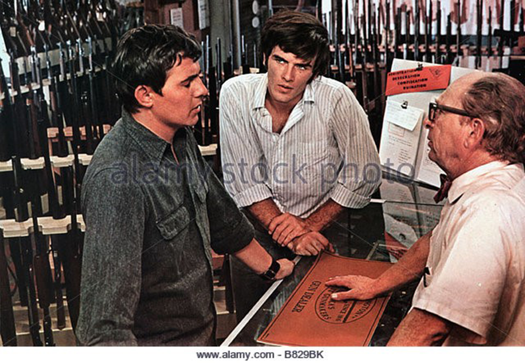 Film still: Bruce Neckels on the left, Mark Frechette, and a gunshop owner in Zabriskie Point